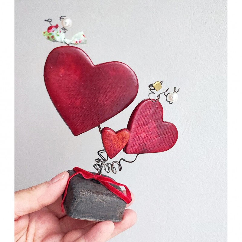 Three red ceramic hearts