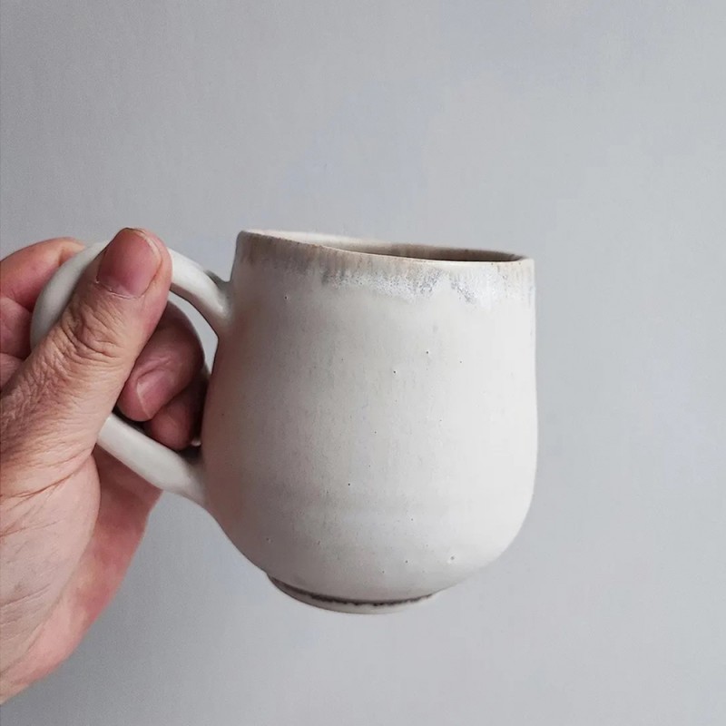 Beige coffee mug, 15x10 cm.