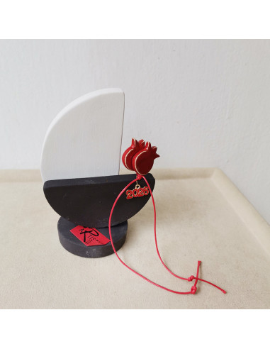 Ceramic sailing boat with red pomegranates, 12x9 cm.