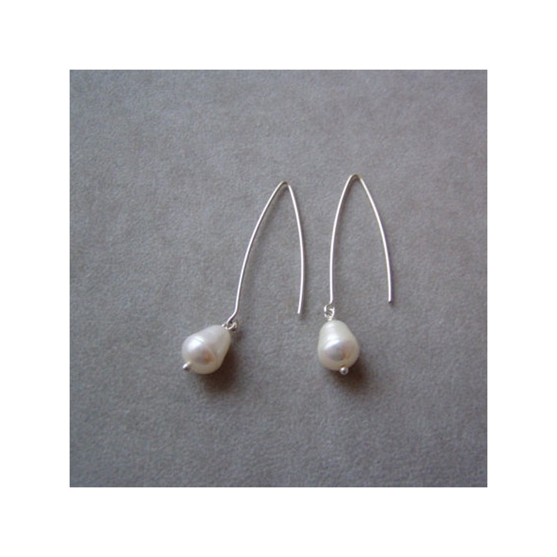 White pearl dangle earrings in...