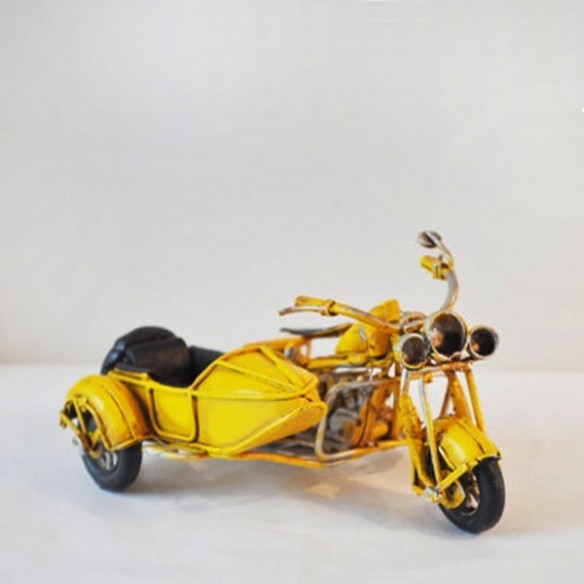 Yellow , metal, miniature retro bike with a side car