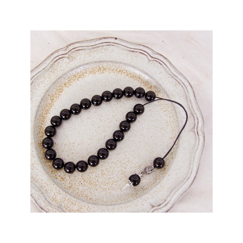 Black onyx worrybeads set on a black...