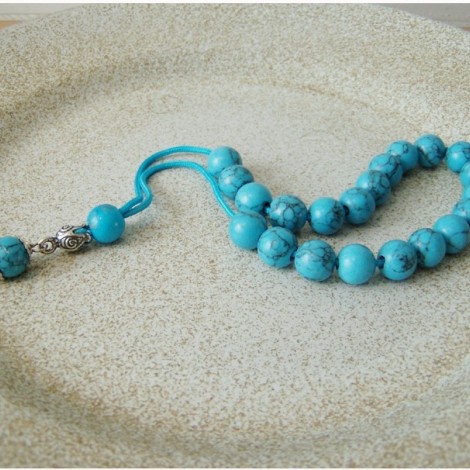 Turquoise and silver worry beads with blue cord
