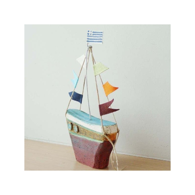 Ceramic sailing boat with colourful flags