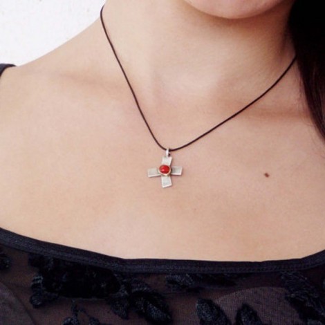 Oxidised stelring cross with 18 K gold and red coral in the middle. 2