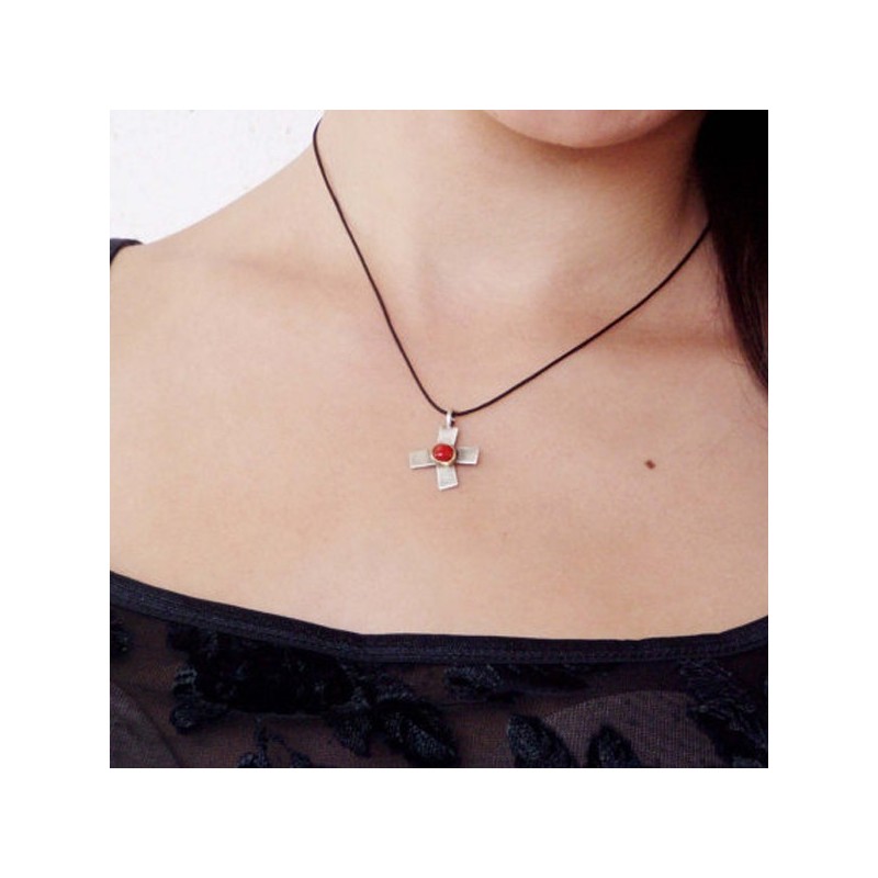 Oxidised stelring cross with 18 K gold and red coral in the middle.