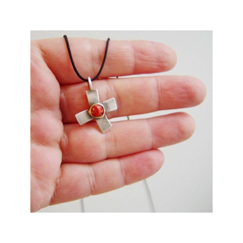 Oxidised stelring cross with 18 K gold and red coral in the middle.