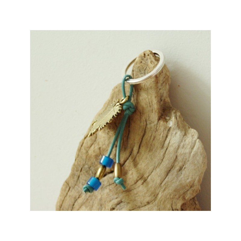Grapevine keychain, brass grapevine leaf on a blue leather cord with brass and glass beads.