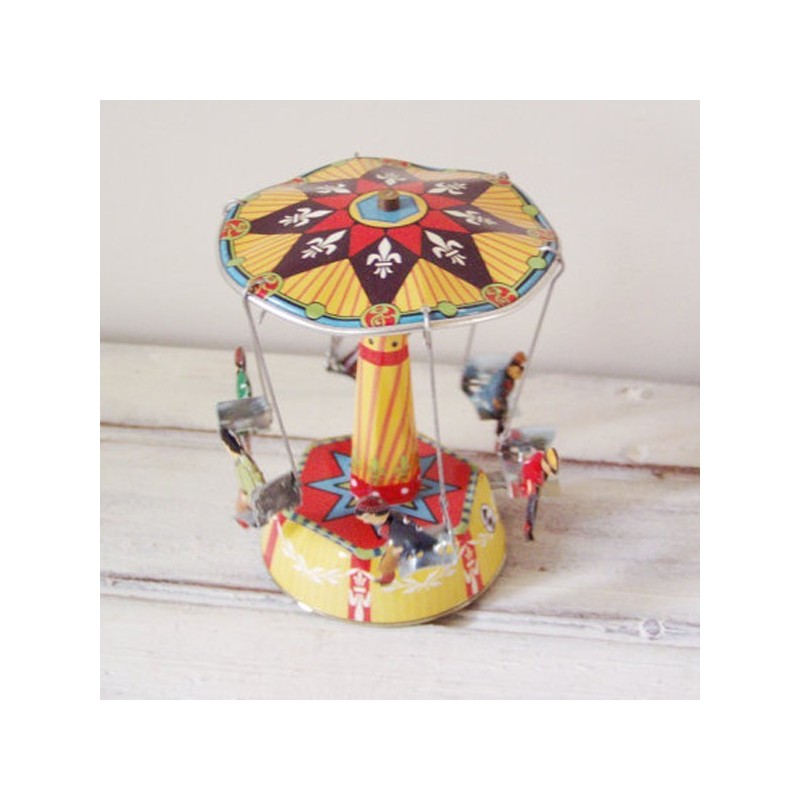 Colourful carousel miniature, tin, merry go round toy with six seated figures, carrousel in red yellow blue