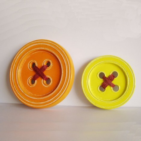 Ceramic button sculpture, stoneware clay, yellow ceramic button wall hanging with burnt orange yarn. 2