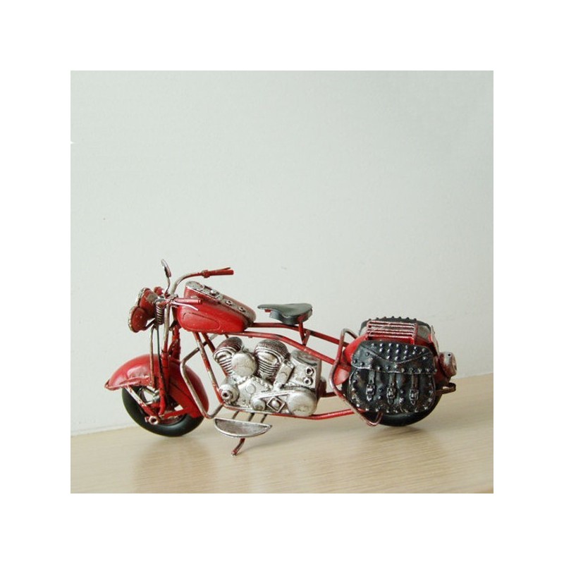 Red motorcycle miniature, metal collectible miniature of a bike with black saddlebags on the sides.