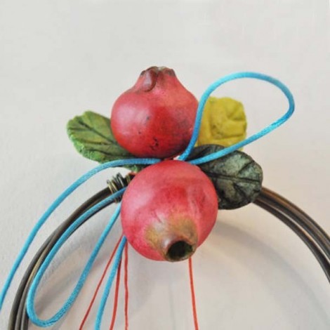 Ceramic pomegranates holiday wreath of bronze wire, ribbons and strings. 2